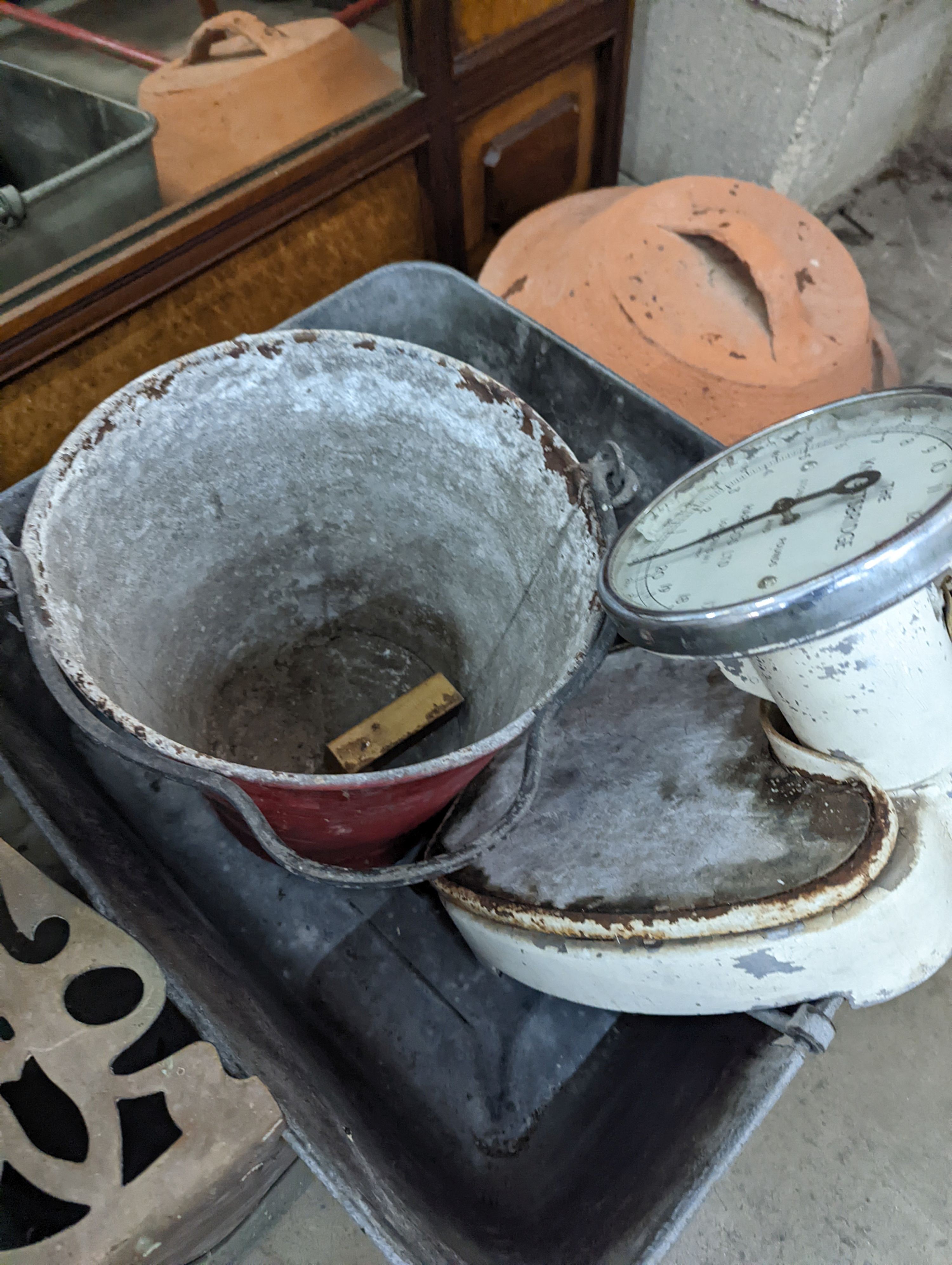 A rectangular galvanised tub, scales bucket, fender, etc.